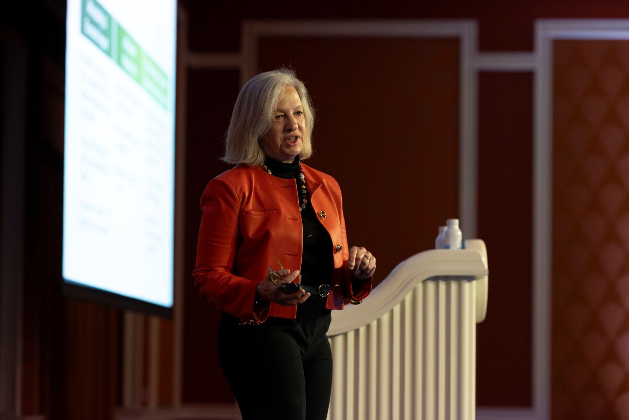 Audrey Zibelman speaking on stage at the OATI Energy Conference.