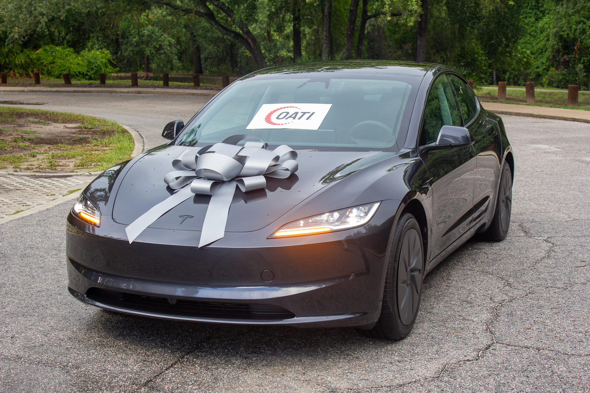 Tesla Model 3 with an OATI sticker