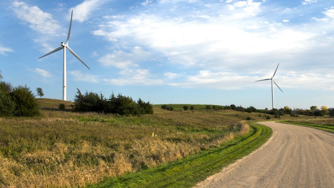 Wind turbine near the UMN Morris campus, site of an OATI GridMind®-managed zinc battery energy storage project