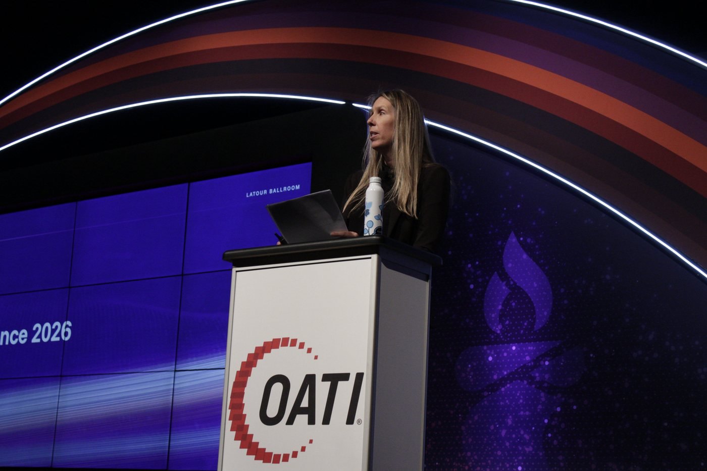 Lauren Burke at the podium in Latour 1-4