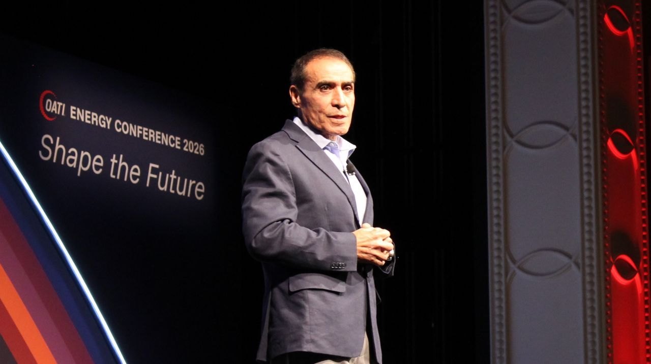 Sasan Mokhtari on stage in front of the Shape the Future backdrop