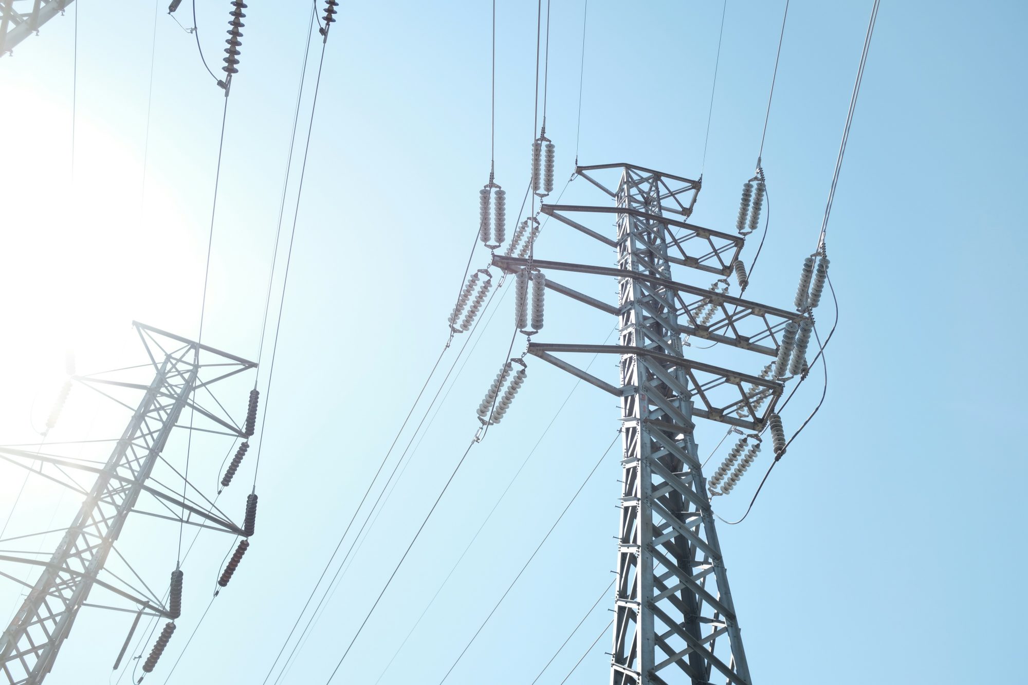A photo looking up at a transmission tower