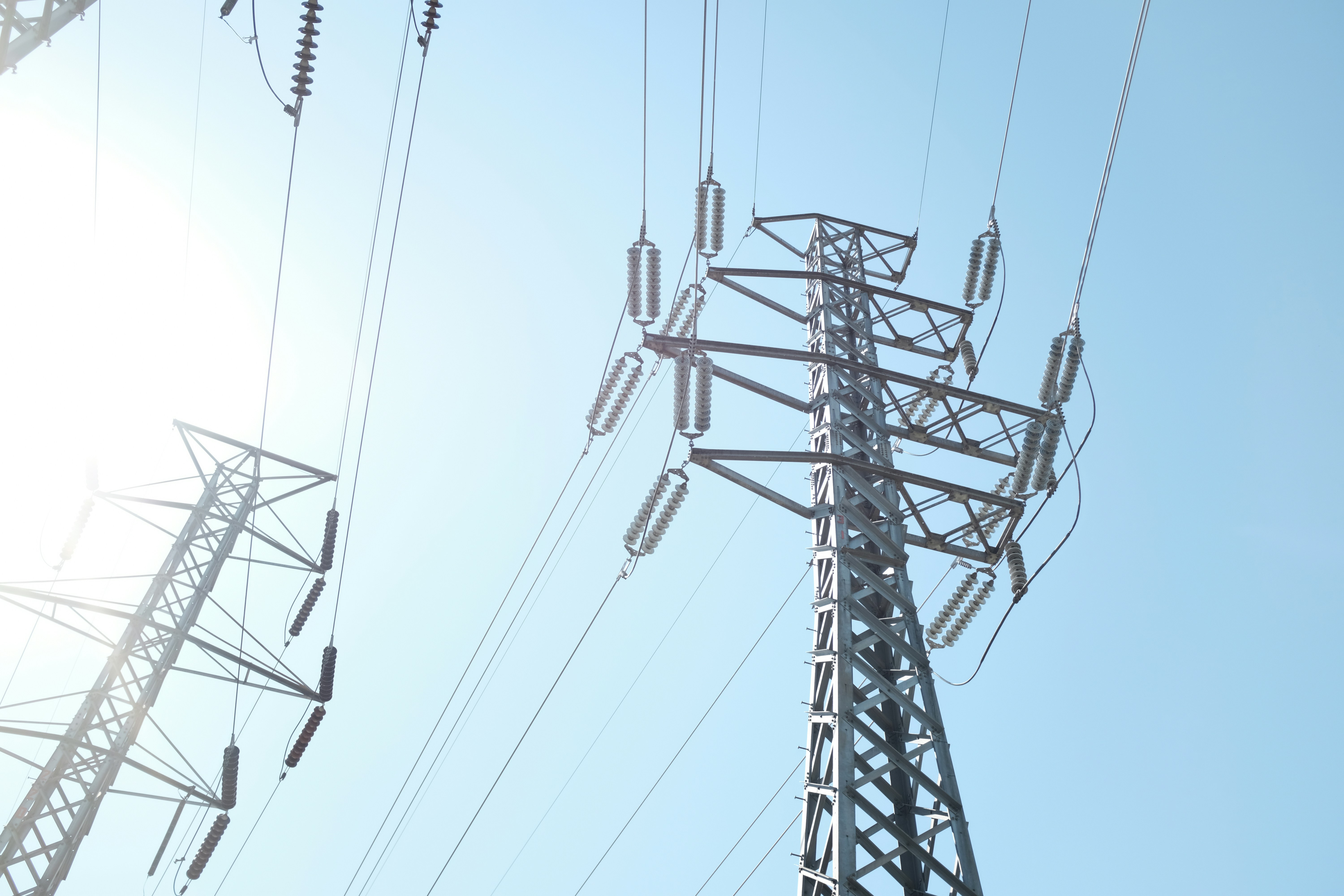 A photo looking up at a transmission tower